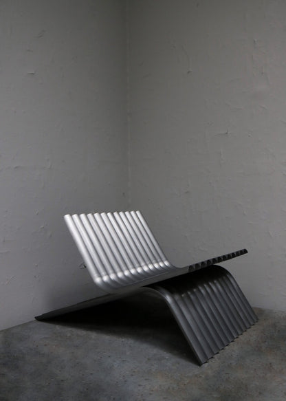 "LOUNGE CHAIR IN STEEL" BY MANU BANO