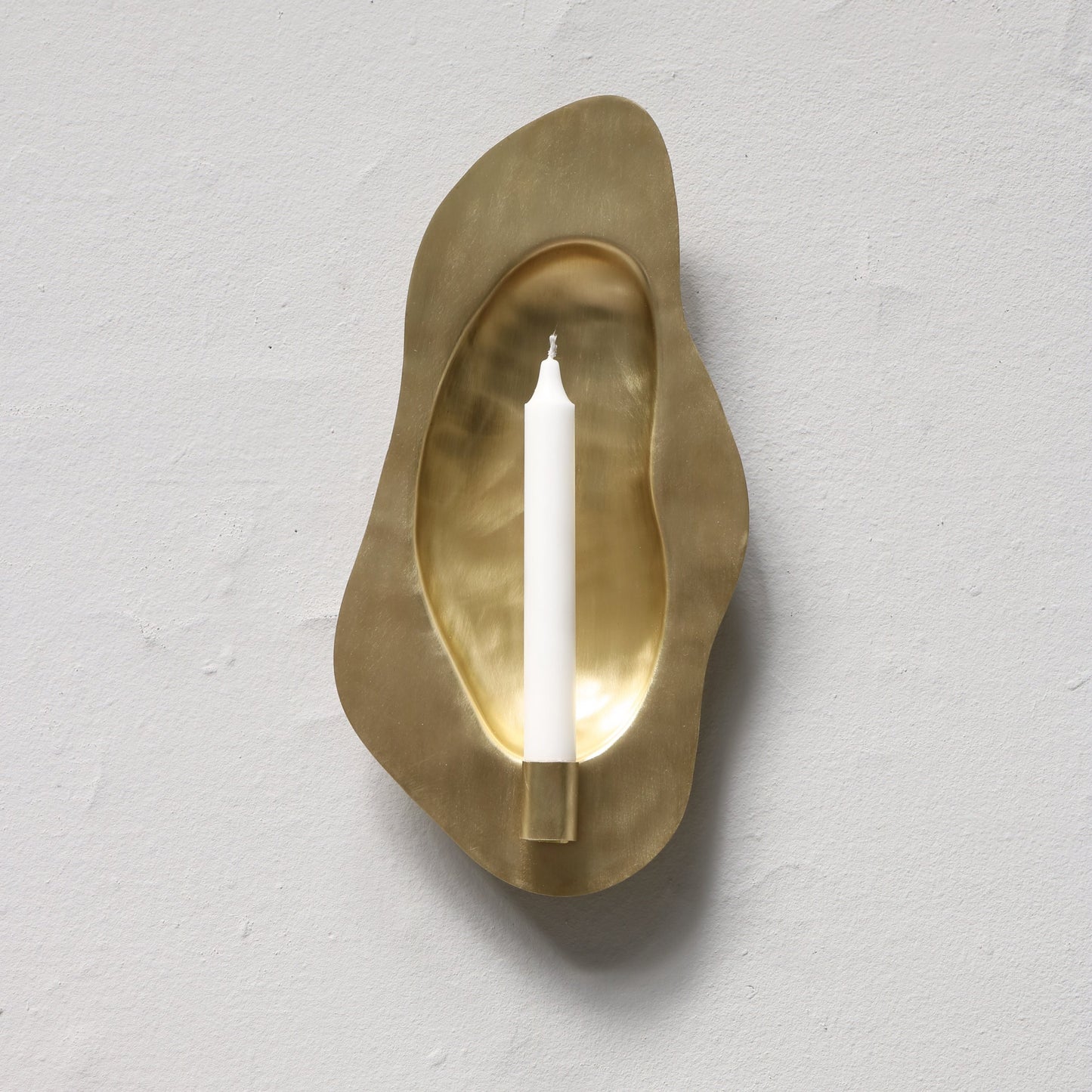 Brass candle holder designed by Christian+Jade Reflecting Flame