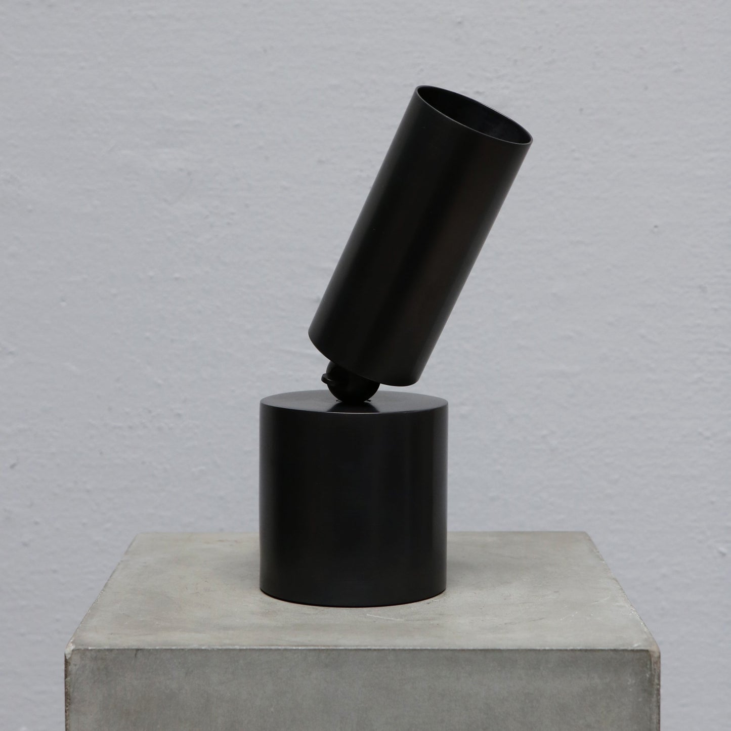 Cylinder uplight in blackened brass by design studio Apparatus