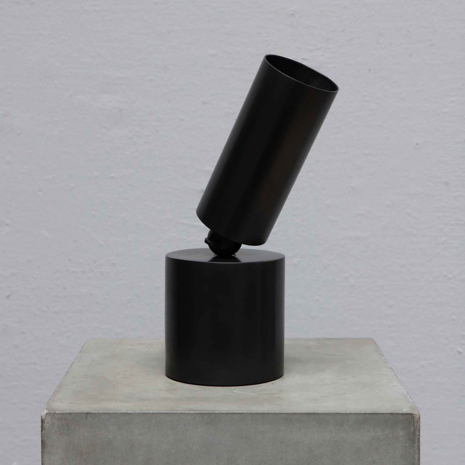 Cylinder uplight in blackened brass by design studio Apparatus