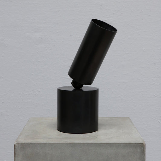 Cylinder uplight in blackened brass by design studio Apparatus