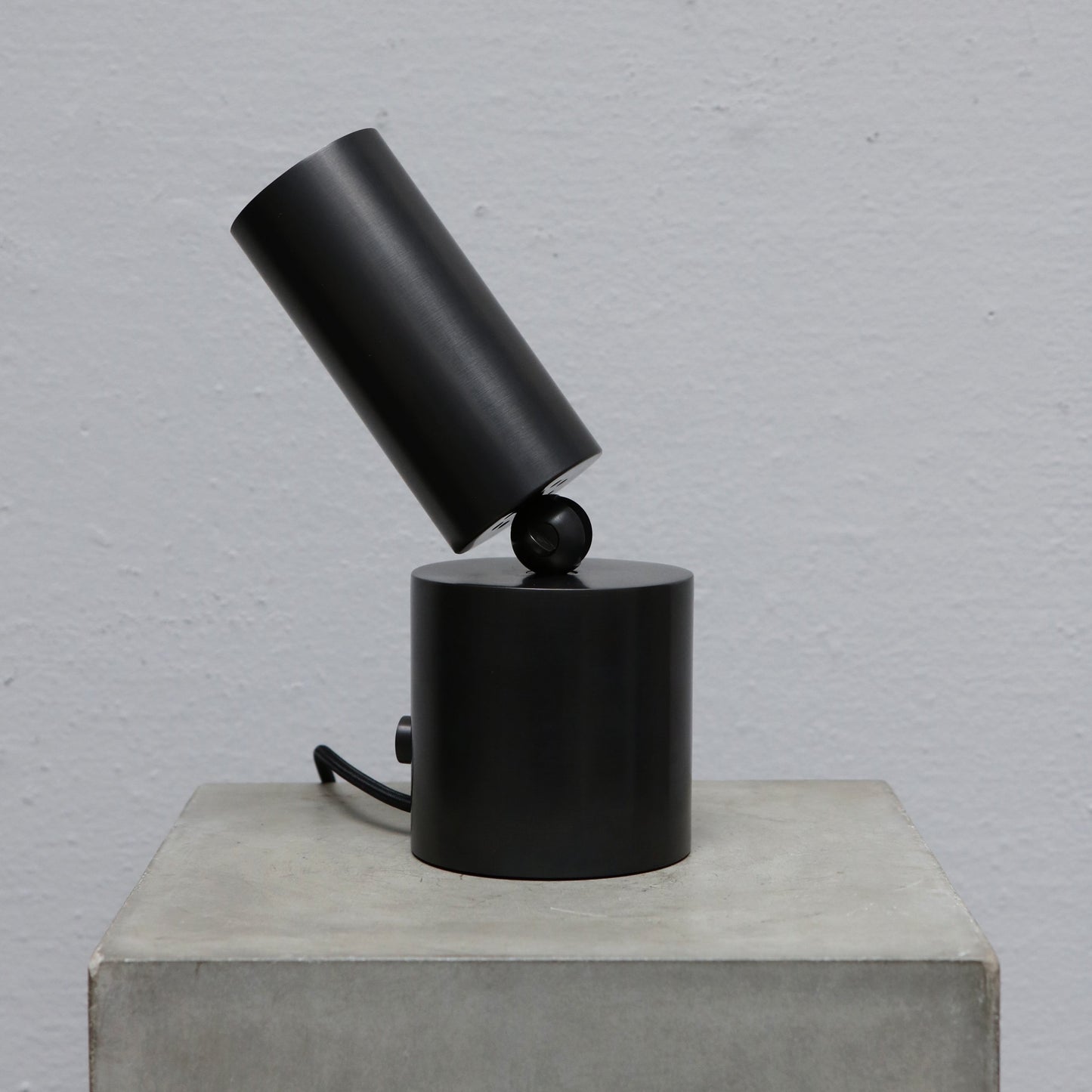 Cylinder uplight in blackened brass by design studio Apparatus