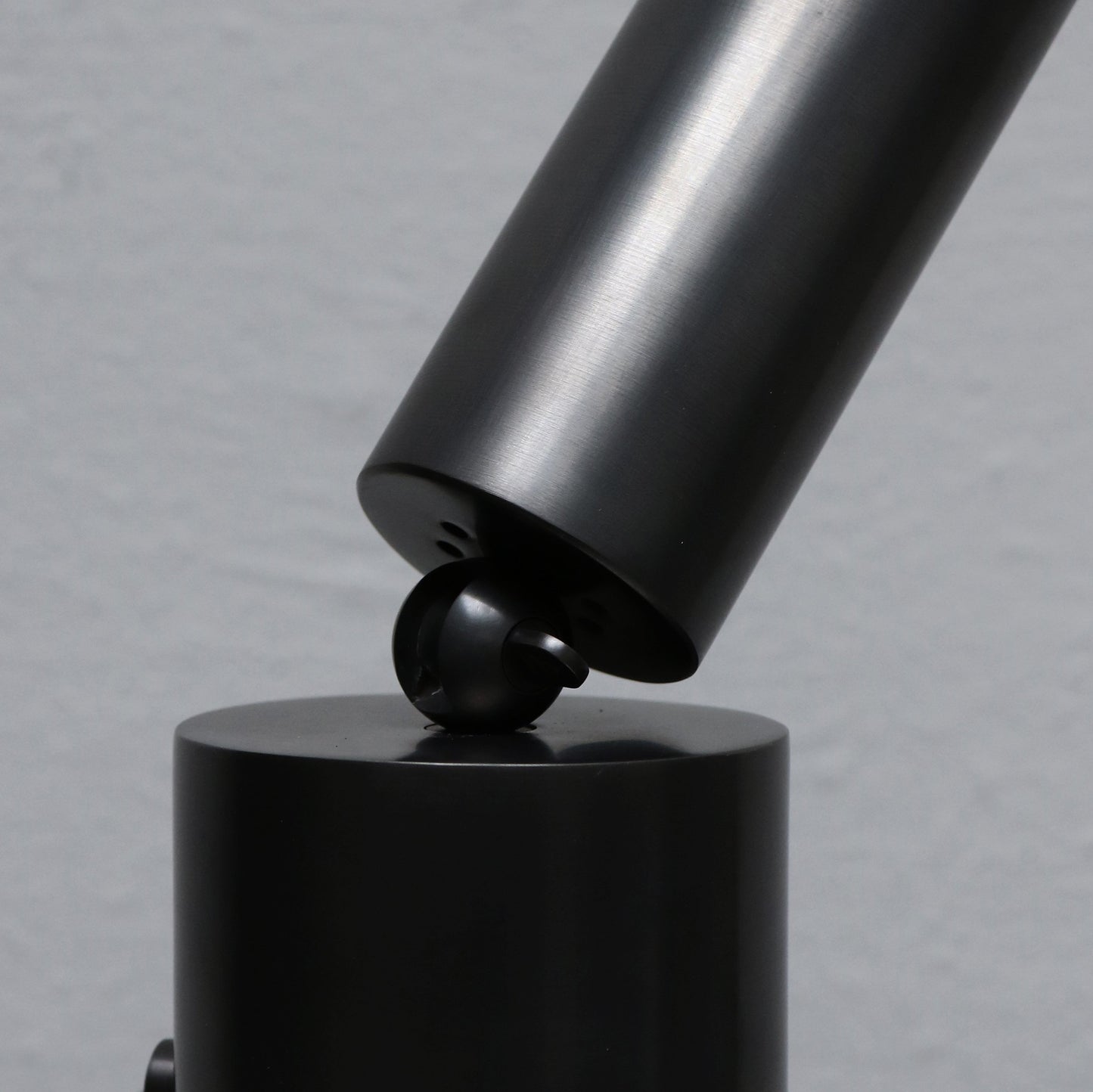 Cylinder uplight in blackened brass by design studio Apparatus