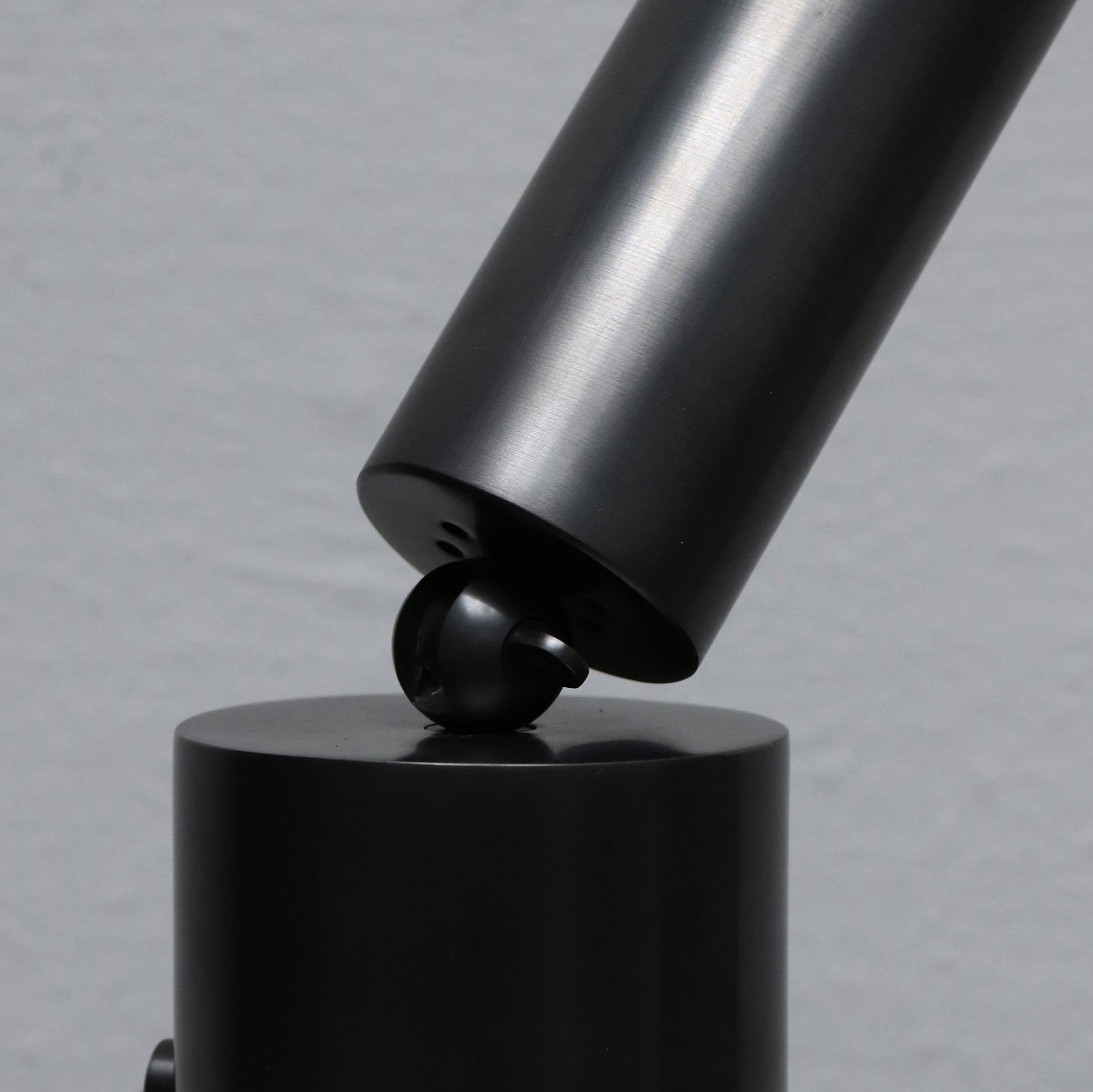 Cylinder uplight in blackened brass by design studio Apparatus
