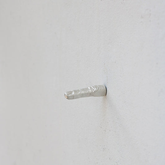 Finger out of wall by Kaare Golles