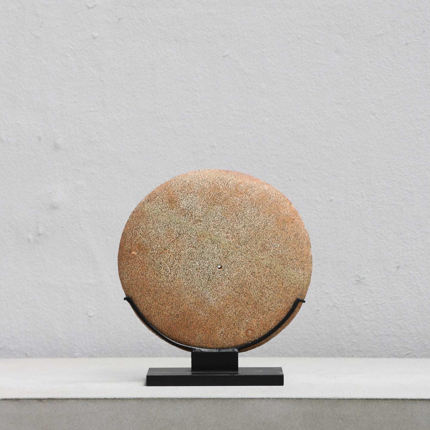 Neolithic stone disc w. central perforation (Niger)