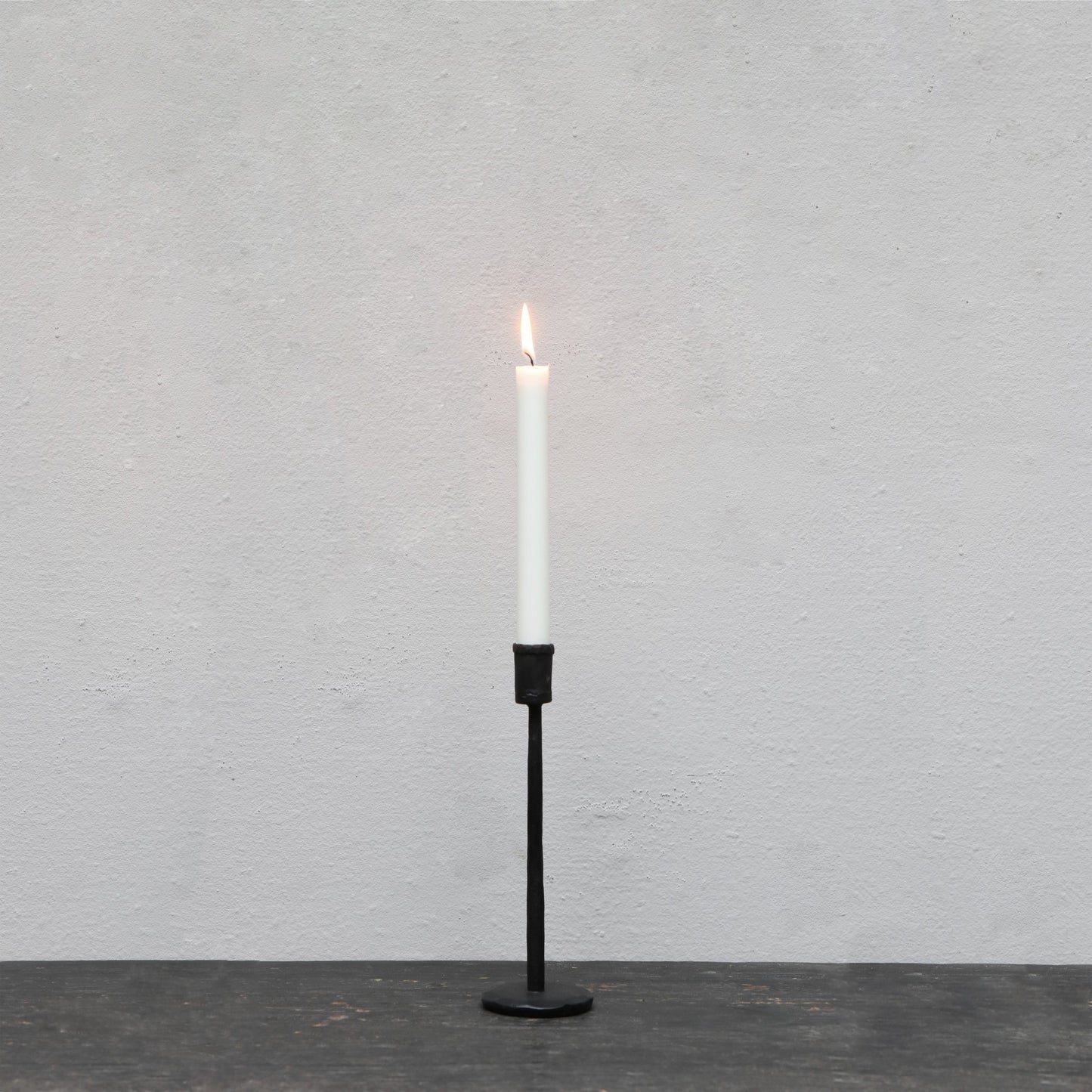 Blackened iron candle stick in small, medium and large