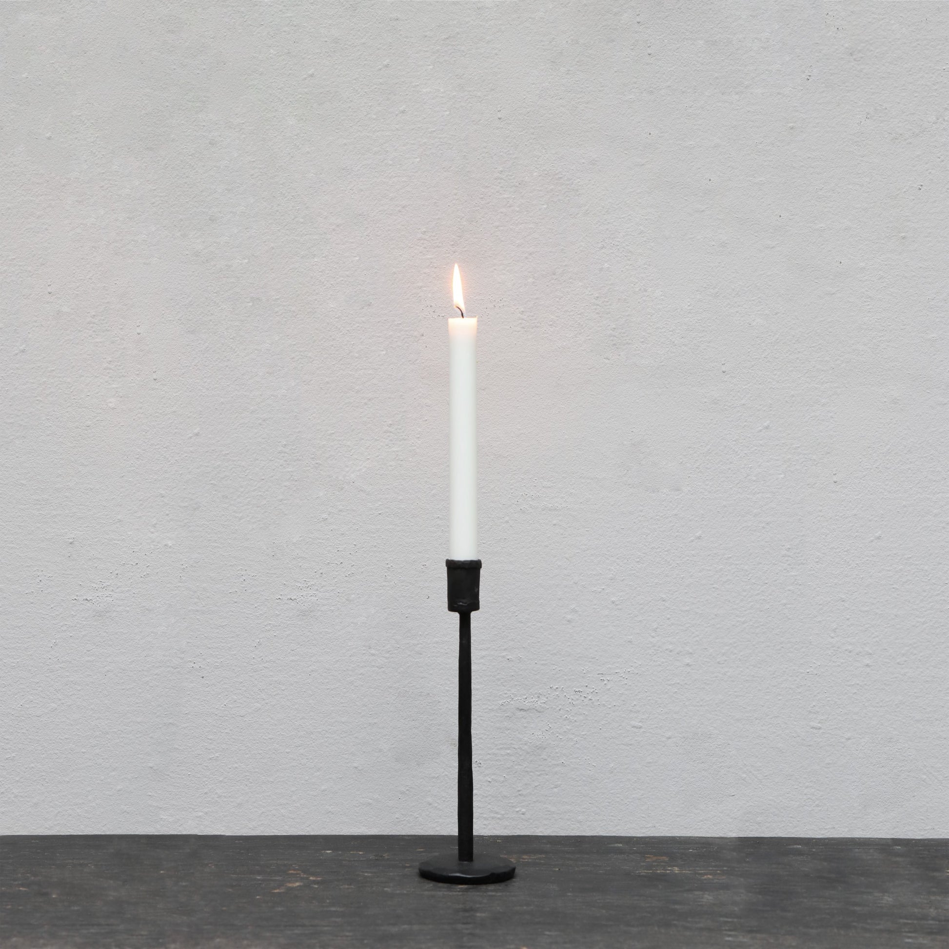 Blackened iron candle stick in small, medium and large