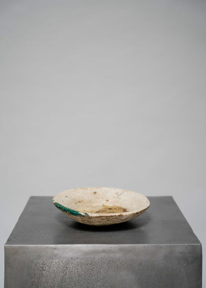 Beige stone bowl w green paint stroke