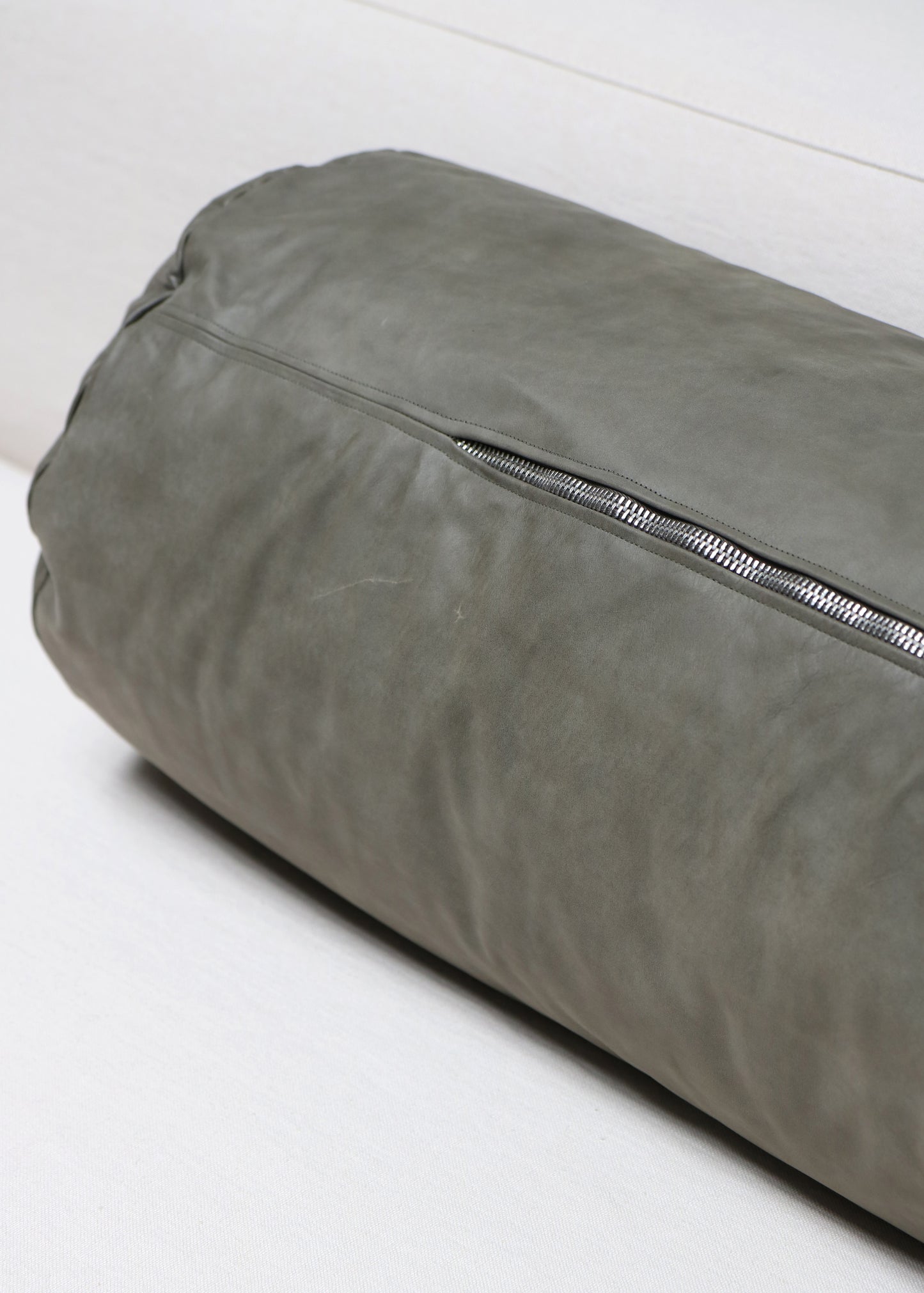 Elongated leather cushion