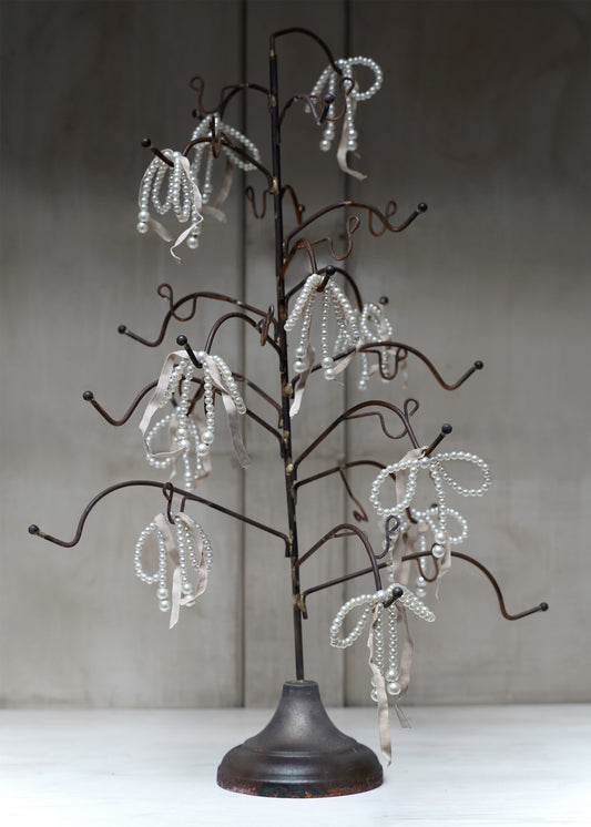 Pearl-bow with pink ribbon