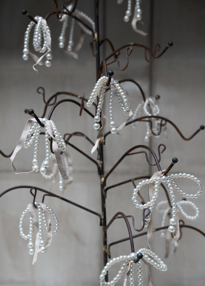 Pearl-bow with pink ribbon