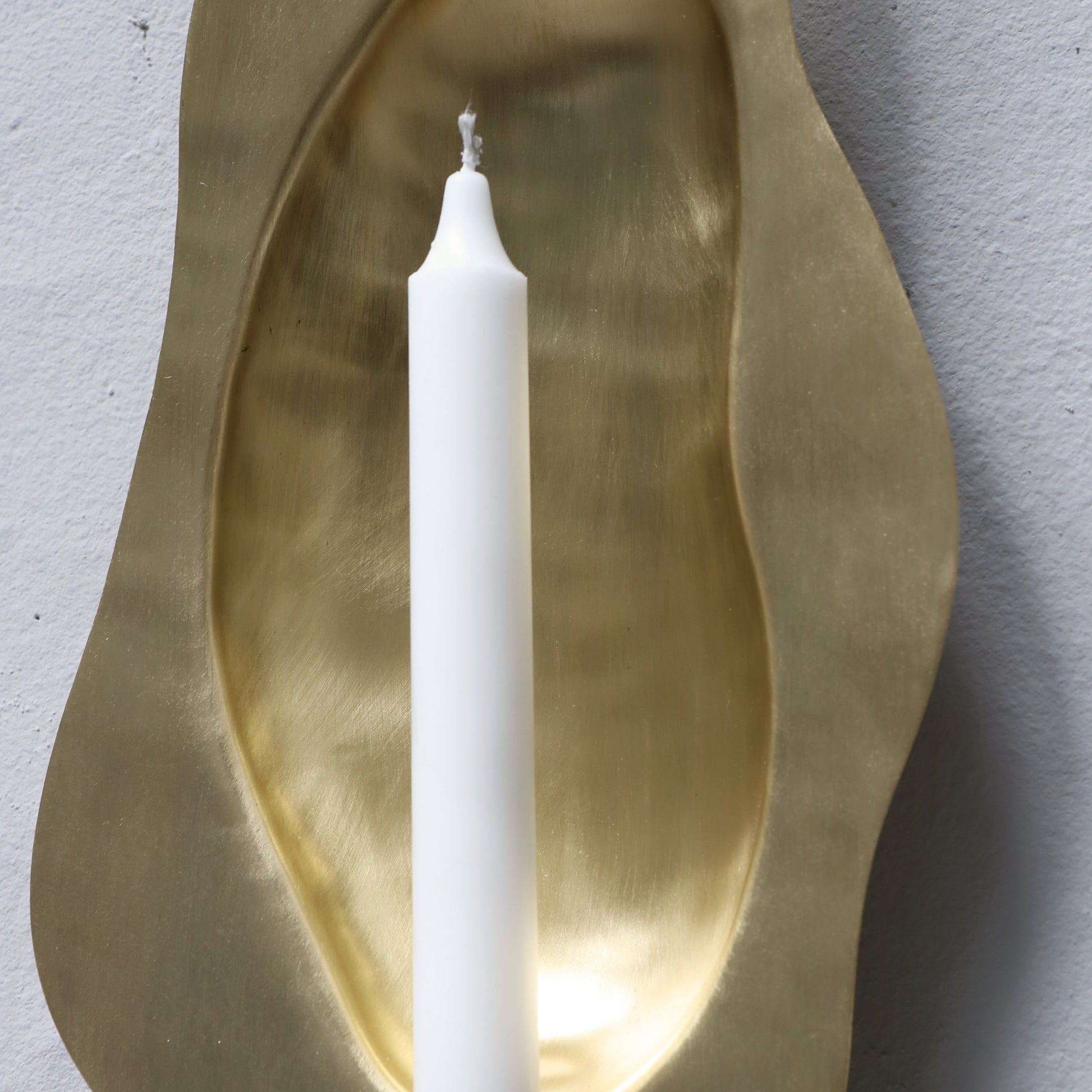 Brass candle holder designed by Christian+Jade Reflecting Flame