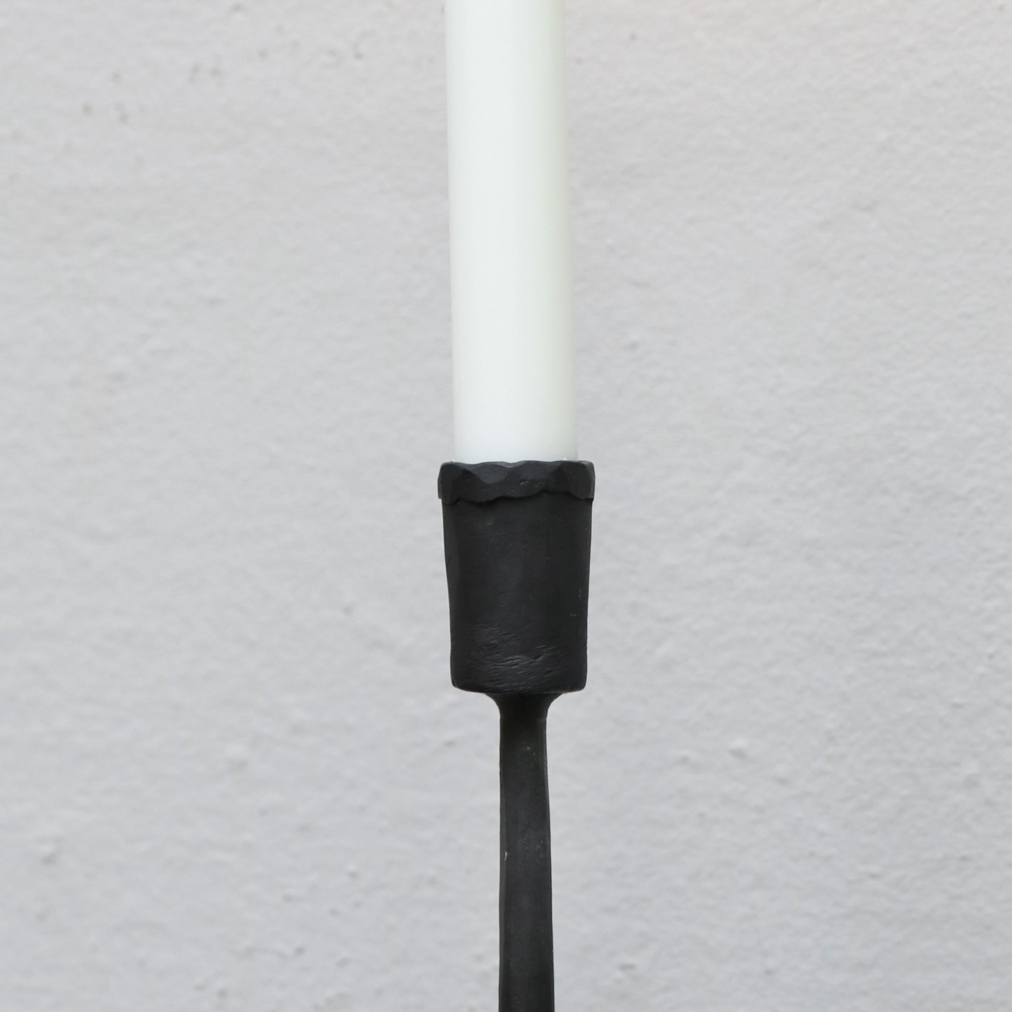 Blackened iron candle stick in small, medium and large