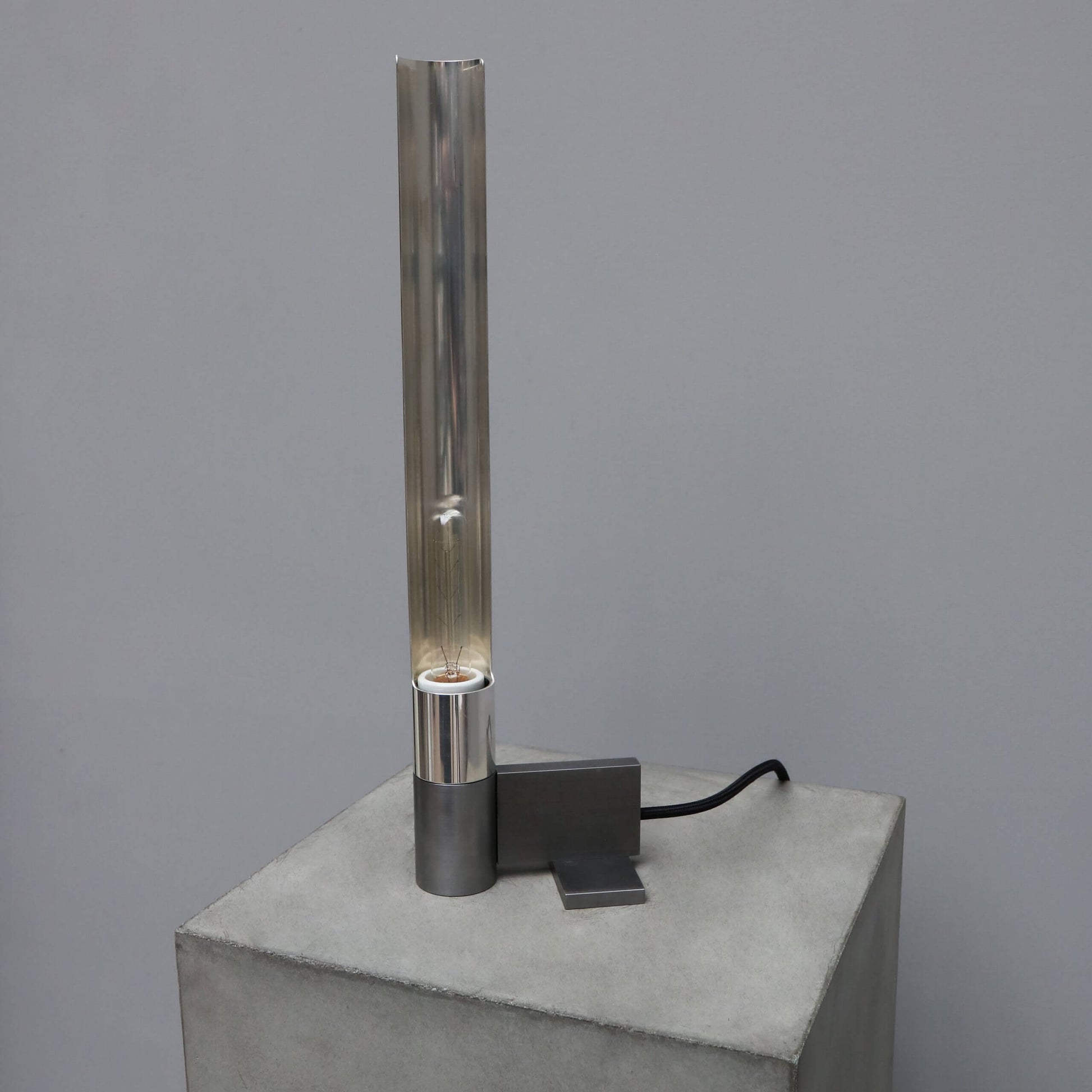 Tribute lamp in iron and silver-plated brass made in a limited edition.