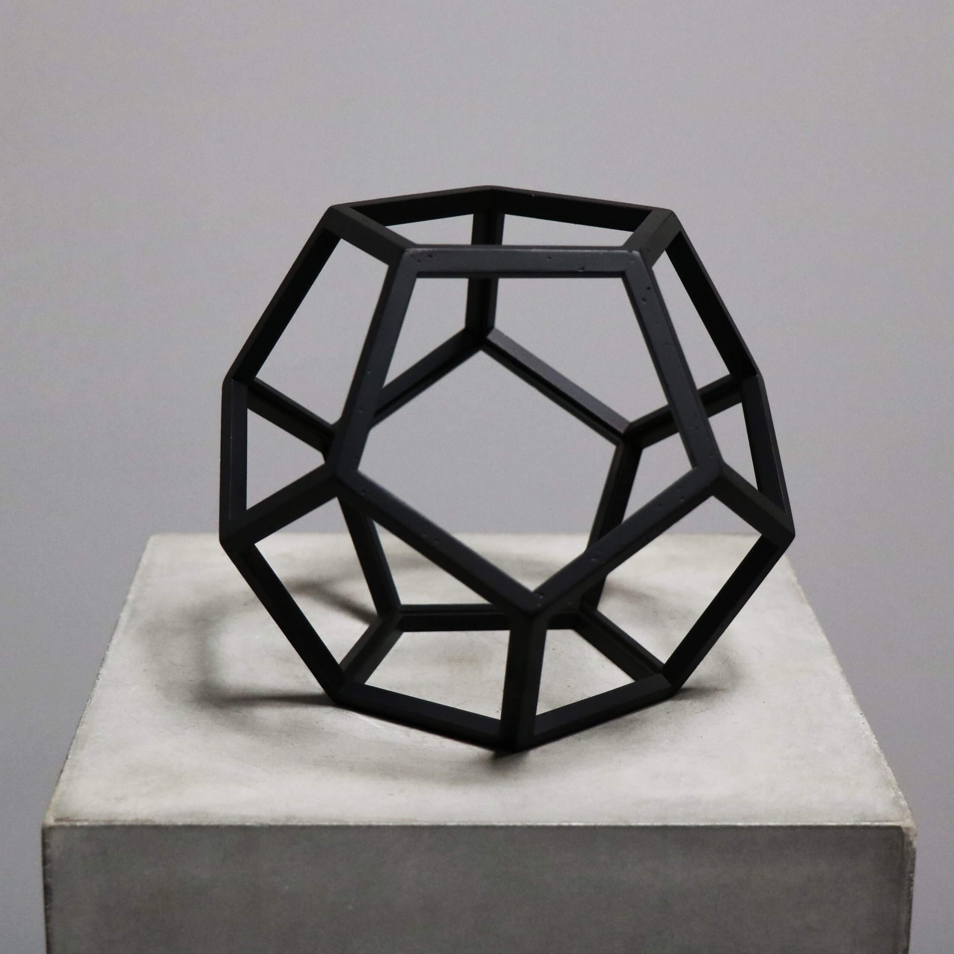 Beautiful geometrical model in burnt black wood dodecahedron