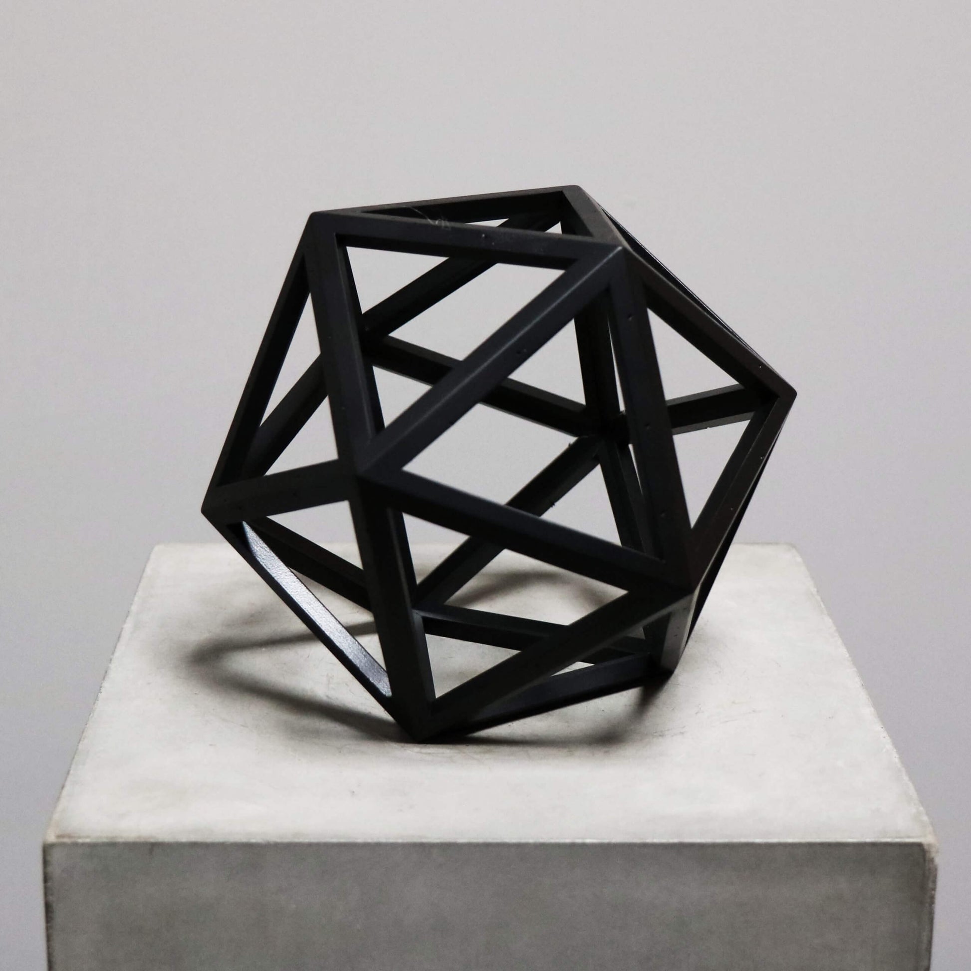 Beautiful geometrical model in burnt black wood for interior design decoration - icosahedron